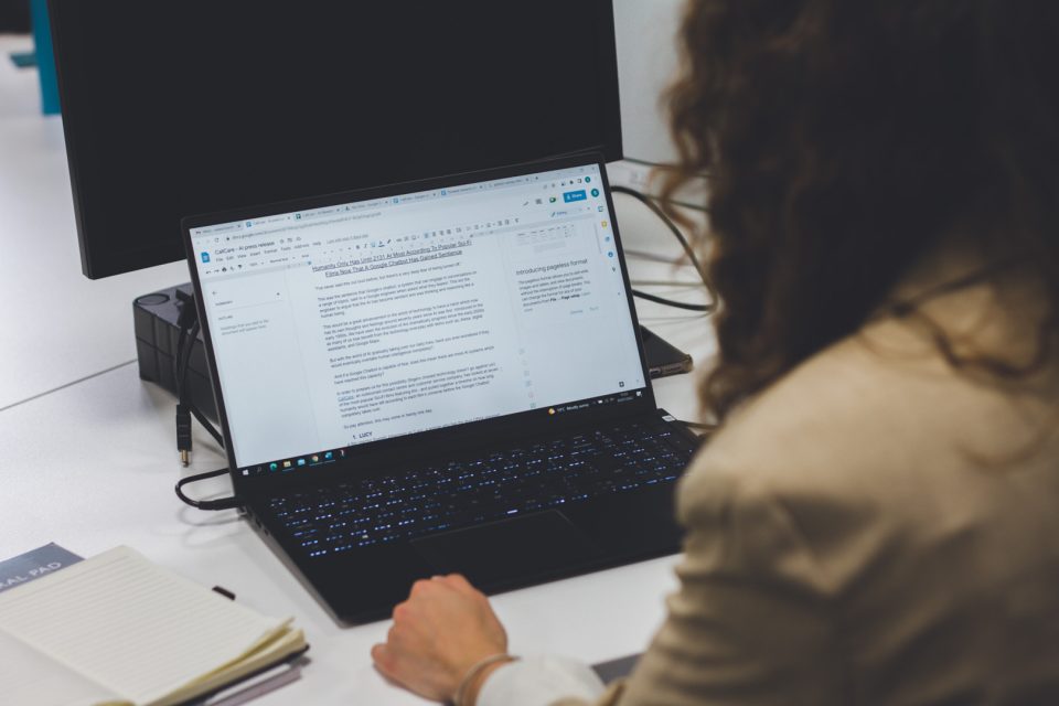 digital pr team member writing a piece on her laptop